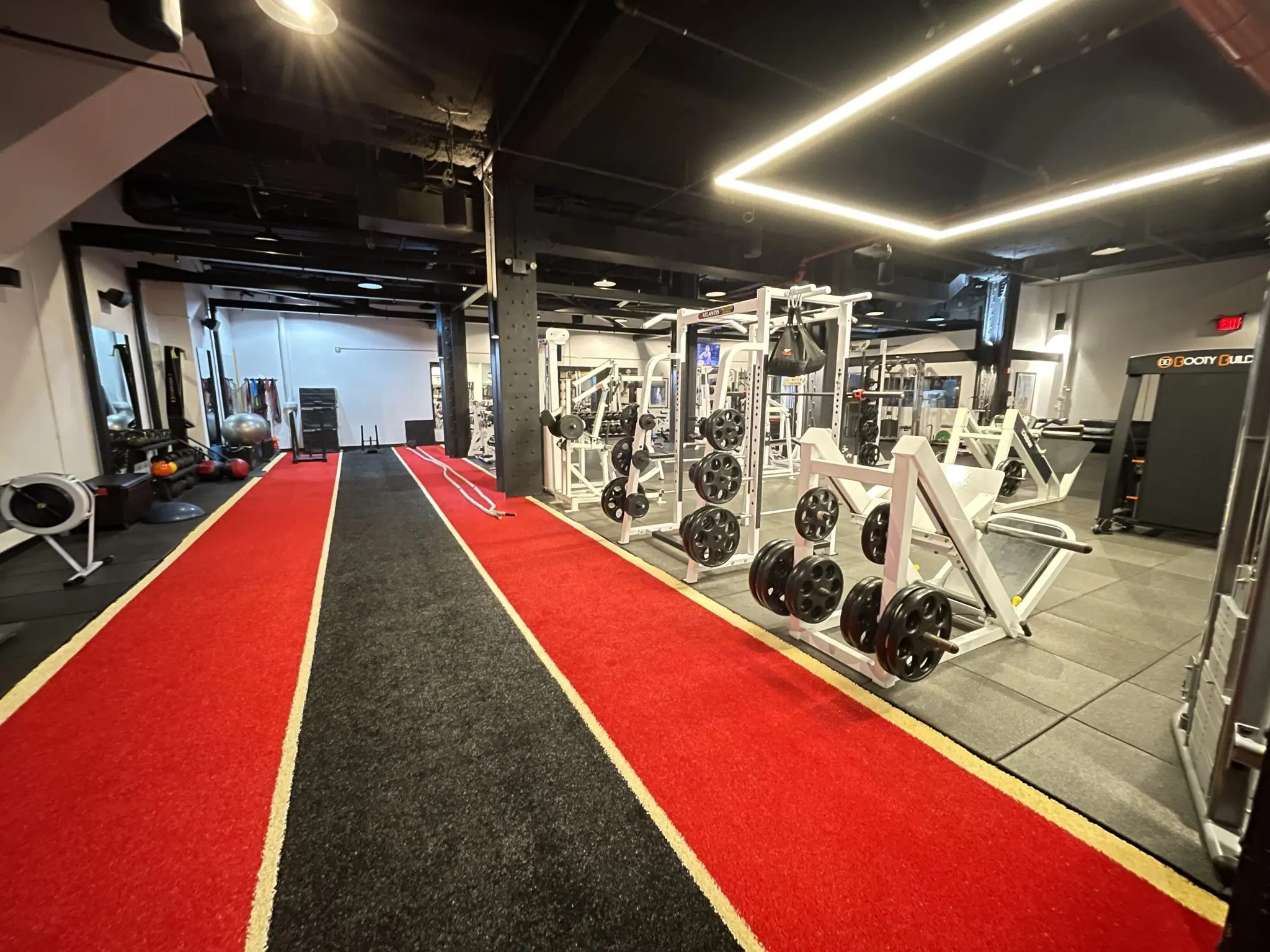 SportsLab NYC training floor with power racks and equipment